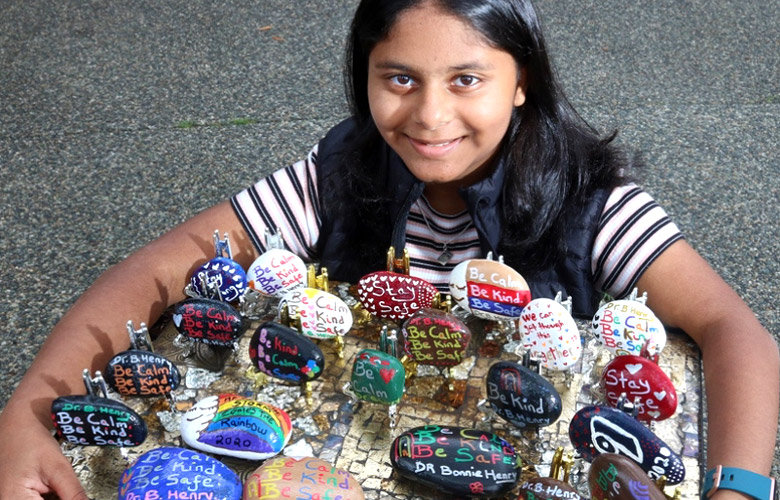 Insiyah Dharsee of the 13th Southwest Ismaili Group shows her display of inspiring Hope Rocks.